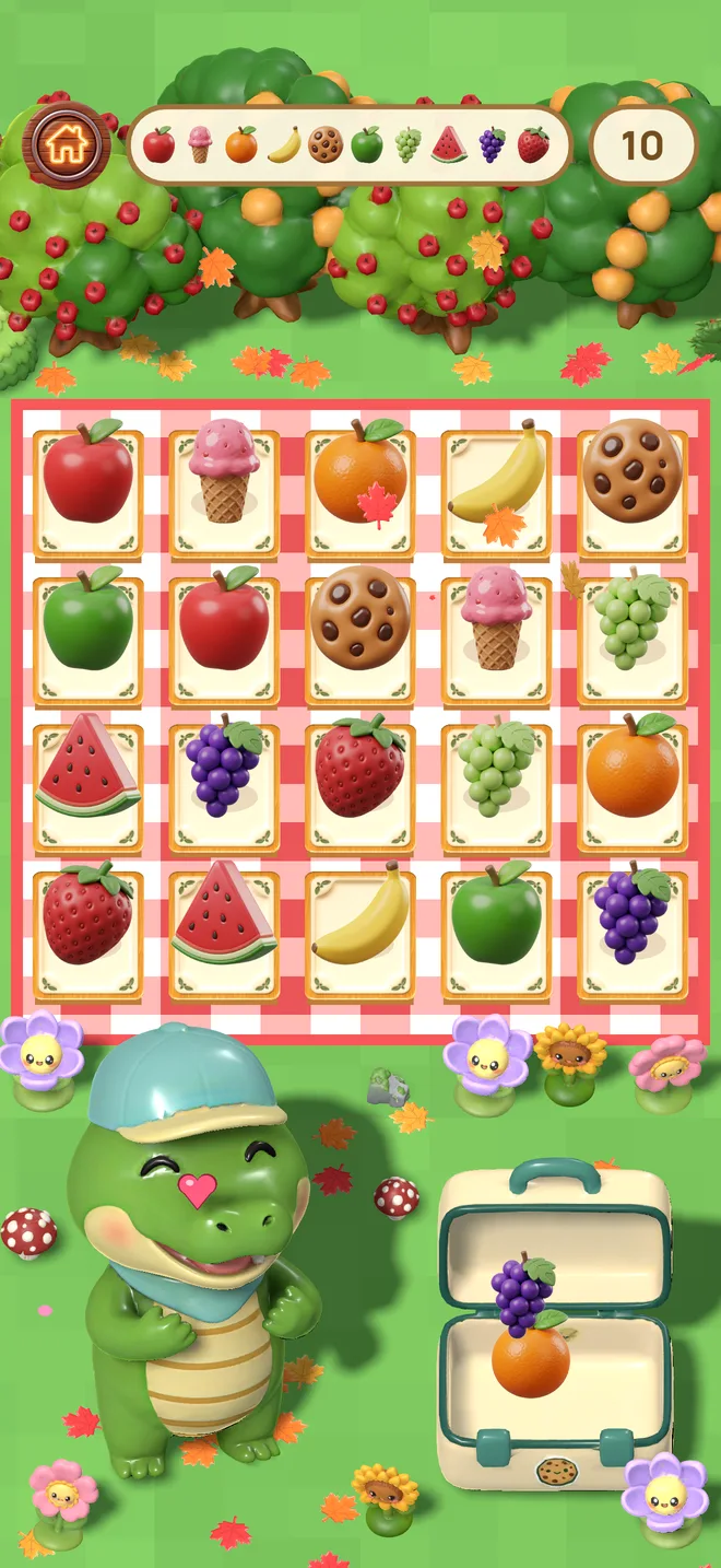 Ollie smiles next to his lunchbox full of fruit after matching all the cards